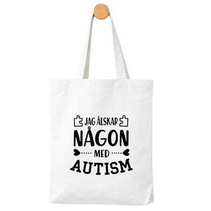 Jag älskar någon med Autism - Tygpåse  💙 Kärlek & acceptans – bär ditt stöd med stolthet!